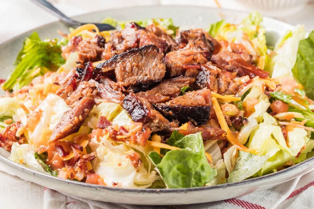 Famous Dave's Sassy BBQ Salad topped with steak