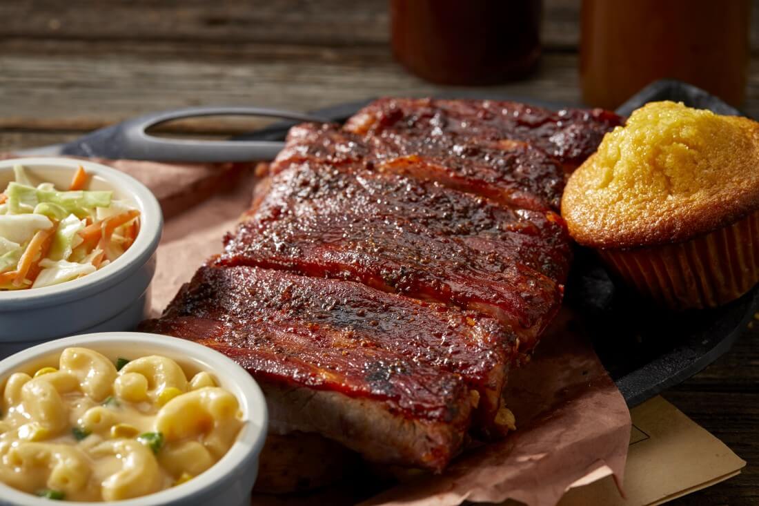 St. Louis-Style spareribs half slab platter with mac and cheese, coleslaw, and a cornbread muffin
