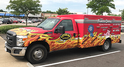 Famous Dave's red branded catering food truck