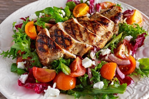 A healthy salad with BBQ chicken cooked to perfection.
