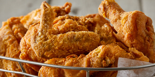 Image of many pieces of Iris’ Down Home Fried Chicken in a basket